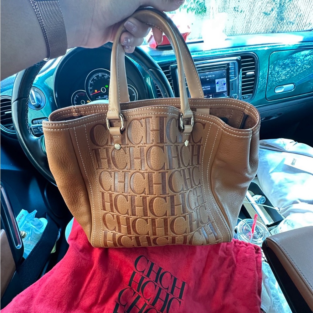 Authentic Carolina Herrera purse, slightly used in good condition.